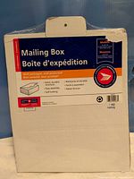 front of sealed Canada Post mailing box showing branding and size