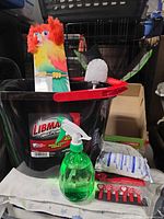 Overall lot showing bucket, duster, brush, spray bottle, wipes, spoons