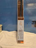 Front of packaged ClosetMax expandable bar showing branding and product