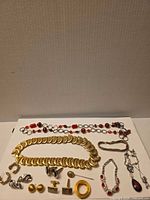 Overview of all jewellery pieces laid out on white background