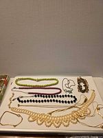 Overview of all jewellery pieces arranged on tray