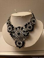 Front view showing full necklace and floral design