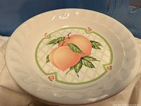 Top view of white bowl showing full peach and lattice design