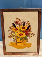 front view of framed crewel embroidery bouquet