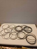 Top view of entire grouping of bangles spread on white surface