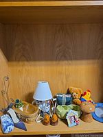 Overall view of assorted decor on shelf