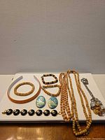 All nine jewellery items laid out together showing full contents