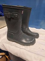 Side view of both boots showing overall condition and color