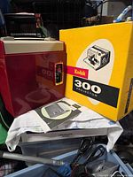 Projector, box, and booklet together