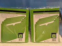 Front view of two sealed Studio C file jacket packs