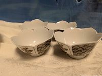 Four lotus-shaped bowls grouped