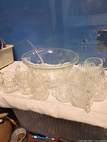 Overall lot with punch bowl, ladle and many cups