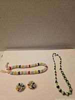 Overview showing necklace, bracelet and earrings