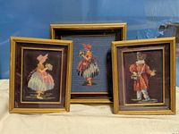 Group shot of all three framed needlepoints