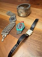 All four wrist watches displayed together