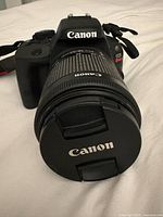Front view Canon EOS Rebel SL1 with lens cap on