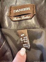 Brand and size tags showing Danier Italian Leather, size W/M UK 14-16