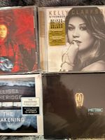 Group shot of four CD fronts showing all album artwork