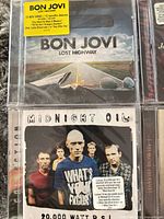 Front covers Bon Jovi Lost Highway and Midnight Oil 20,000 Watt R.S.L.