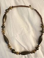 Mixed bead and metal necklace showing bead shapes, colors, clasp