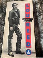 Front view of slipcase showing Lou Reed photograph and title