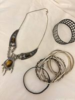 Group shot of necklace, cuff and bangles