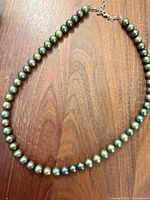 Full view of necklace showing strand and extender