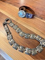 Full view of leather strap, buckle and separate metal link section