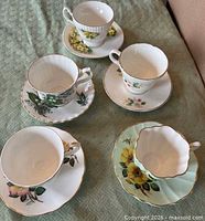 Top view of all five teacup and saucer sets