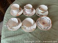 Six assorted teacup and saucer sets front view