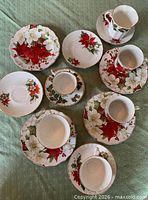 Overview of teacups, saucers and creamer displayed