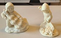 Both Snowbabies figurines side by side
