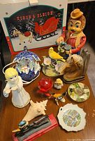 All items arranged on table in front of boxed wooden horse sleigh kit