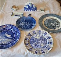 Front view showing all four blue-and-white plates