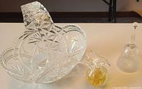 Overall view of basket dish, perfume bottle, bell