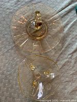 Two yellow depression glass serving pieces