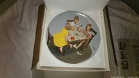 Top view of plate inside foam showing children playing cards scene