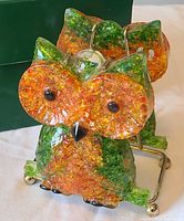 Front view showing owl shape, crushed lucite colors, eyes and beak