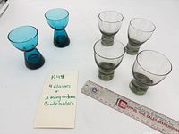Group view: 2 blue candleholders, 4 smoky green cocktail glasses, size reference card and ruler