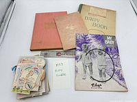 Lot overview showing record books, magazine and greeting cards