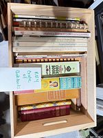 Top view of crate showing multiple cookbooks and pine crate construction