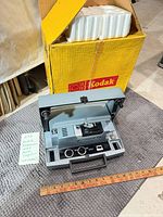 Projector open, showing controls and carry handle