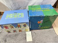 Two branded Letter People boxes side by side