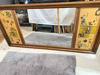 Front view showing full mirror and side graphic panels