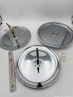 All three round serving pieces laid out