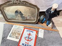 All items together: framed photo, ceramic figurine, print, banner