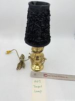 Full view of brass teapot lamp with shade and cord
