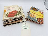 Stack of vintage cooking booklets and note reading "K11 Cooking Booklets"