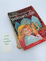 Stack of magazines with Woman's Day on top