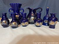 All eight cobalt blue ceramic pieces front view